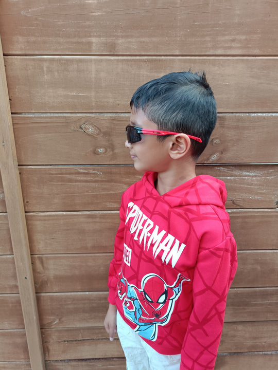 Child wearing Tākaro Black Red kids sports sunglasses NZ — Te Rā