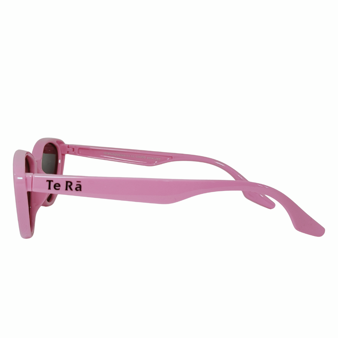 Child wearing Māhanga Flamingo Pink cat-eye sunglasses NZ — Te Rā